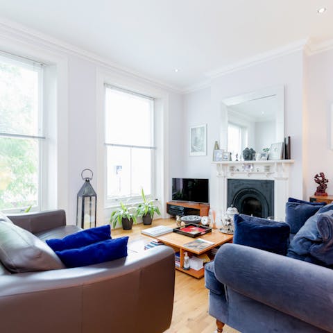 Kick back in the bright living room with a glass of wine after a day of London sightseeing