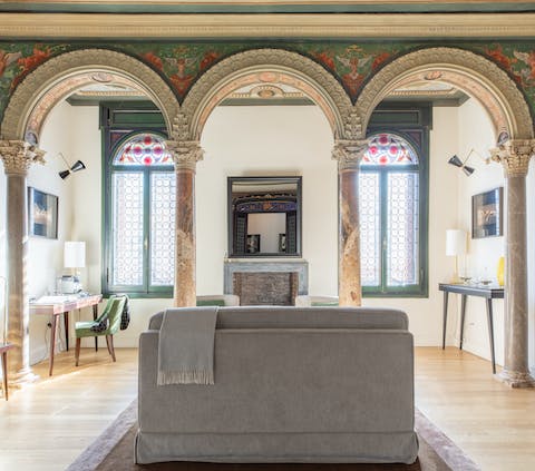 Sink into the sofa while taking in the elegant marble arches above