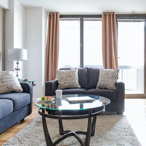 Kick back in your living room with a glass of wine after a day of exploring the city