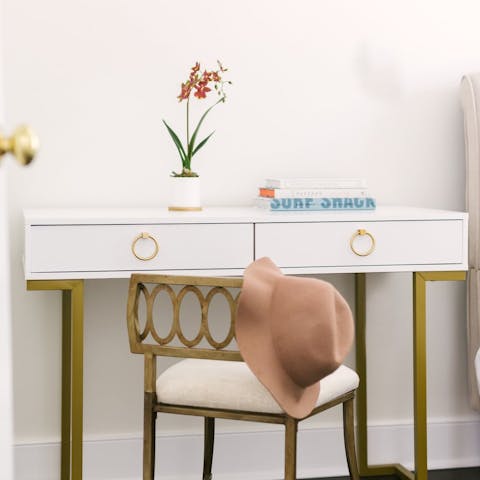 Catch up on emails at the cute writing desk