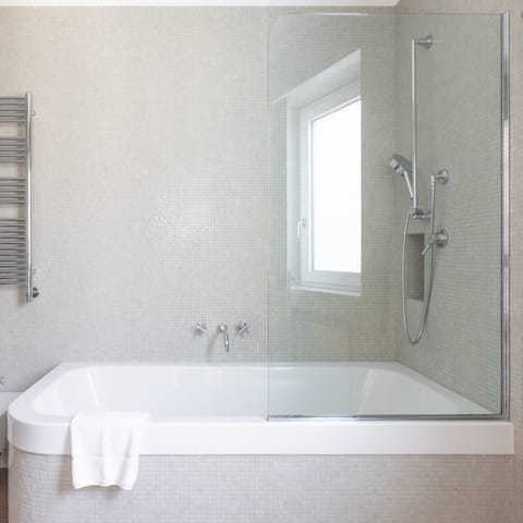 Relax sore feet with a soak in the master bathtub