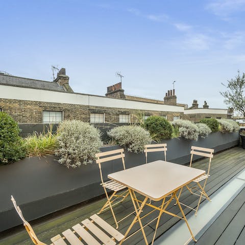 Relax on the private roof terrace, perfect for sipping sundowners