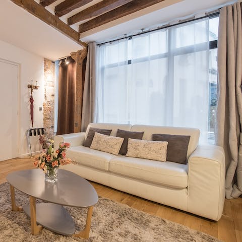 Kick back in the elegant living room with a glass of French wine after a day of Paris sightseeing