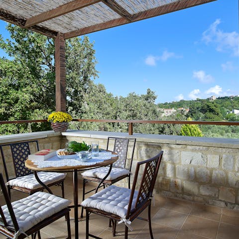 Sit down for breakfast with a view up on the covered first-floor terrace