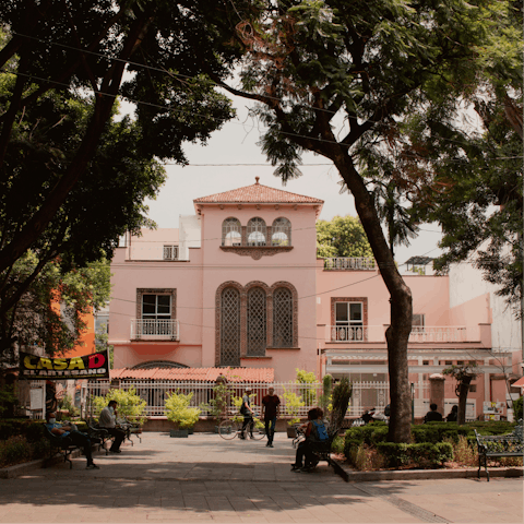 Stroll around Jardin Centenario, a five-minute walk away