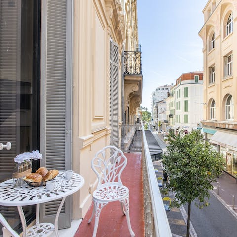Start your day with breakfast out on the balcony, overlooking the elegant street below