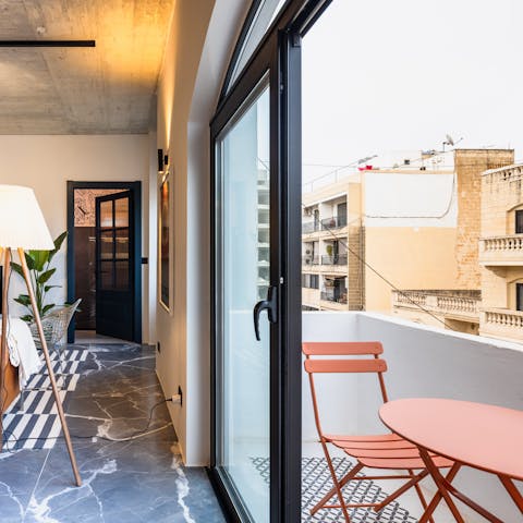 Enjoy your morning coffee on the private balcony