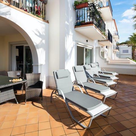 Chill out with a refreshing drink on the private sun-dappled terrace