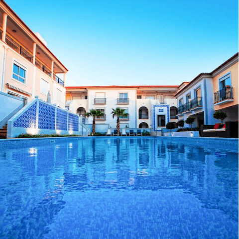 Unwind on a day bed or cool off in the shared pool
