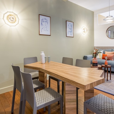 Gather together for a celebratory meal around the designer slab dining table