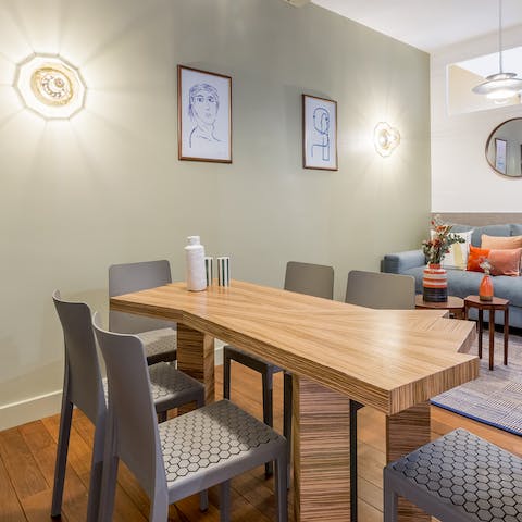 Gather together for a celebratory meal around the designer slab dining table