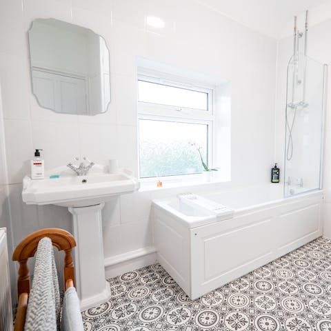 Treat yourself to a long and indulgent soak in the super-sleek bathroom