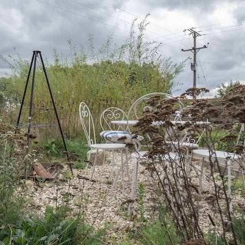 Sit outside in the garden and light up the fire pit once darkness descends