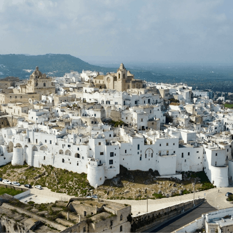 Visit nearby Ostuni to explore its white-washed streets