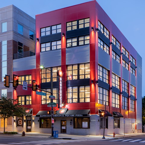 Stay in a modern, industrial style building with a pizzeria on the ground floor