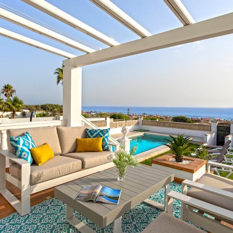 Take in sparkling sea views from the elevated terrace