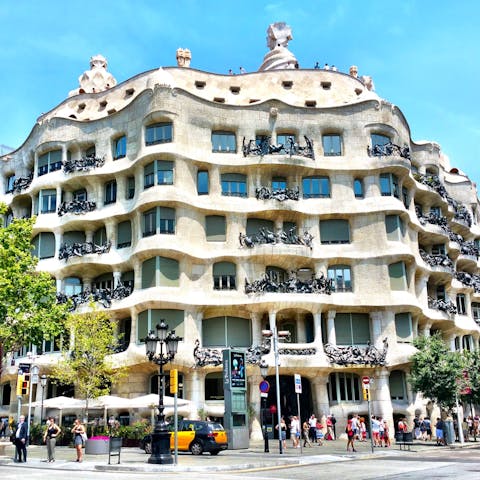 Admire the architecture of Casa Milà, a short walk away