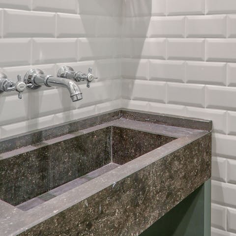 Freshen up at the luxurious grey marble sink