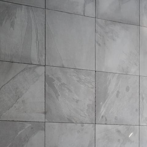 The sleek black slate in the bathrooms