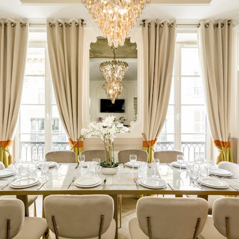 Dine underneath the light of the French glass chandelier