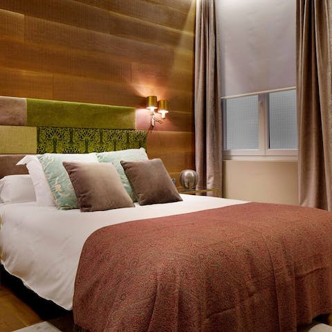 Sleep in the trendy wood panelled bedroom