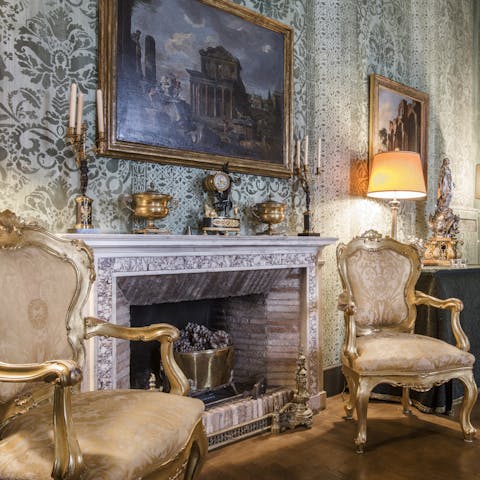 Cosy up around the beautifully ornate fireplace