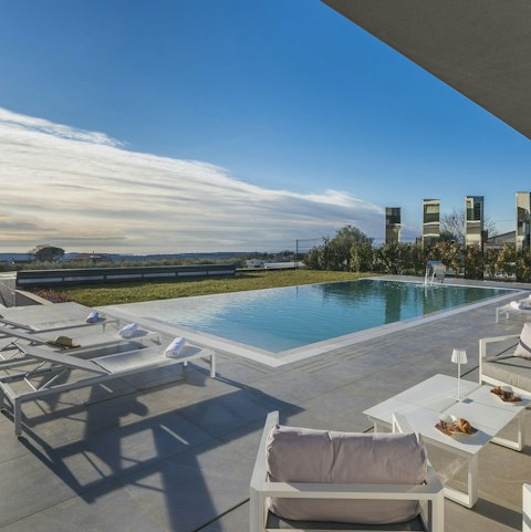 Find peace and relaxation while lounging by the pool