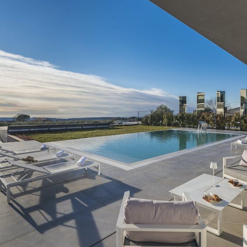 Find peace and relaxation while lounging by the pool