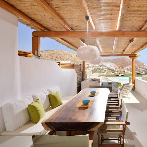 Gather around the outdoor table for cocktails and chatter in the sunshine