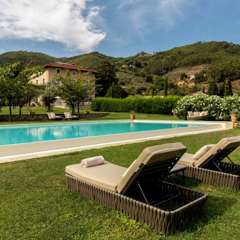 Lie back and catch some sun by the large outdoor pool