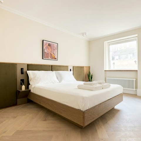 Wake up feeling refreshed in the elegant bedroom