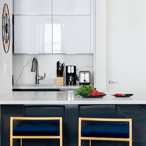 A bright kitchen island with barstools