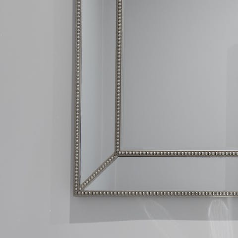 Enjoy elegant touches like the beaded bathroom mirror