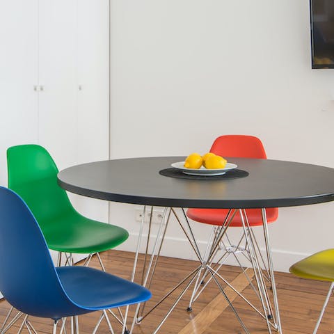 Chromatic dining area with comfy chairs