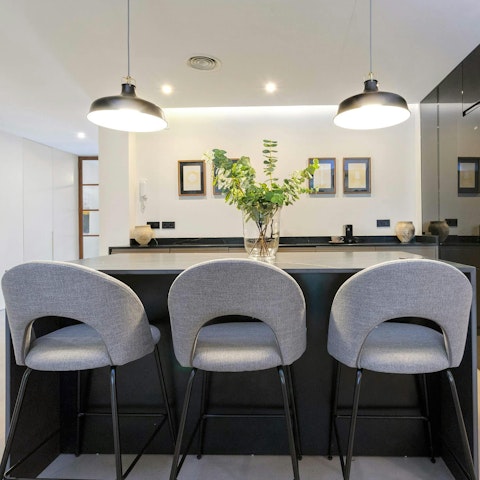 Enjoy breakfast at the kitchen bar before exploring Seville