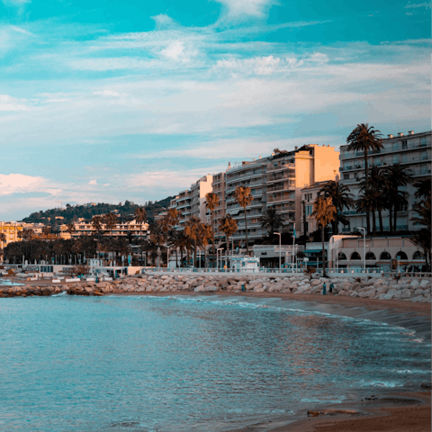 Sink your feet into the sand at Croisette beach
