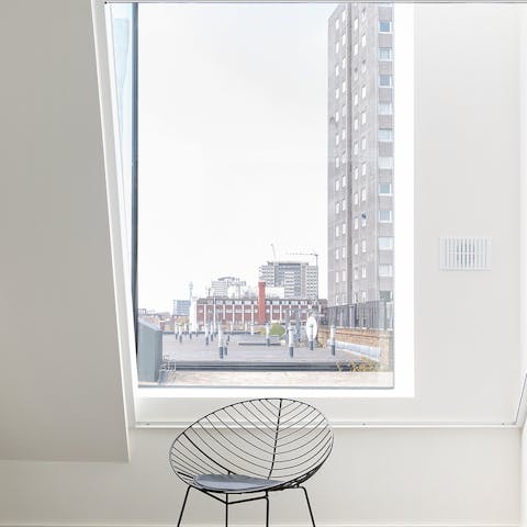 Find a sunny reading spot by the striking metre-long windows