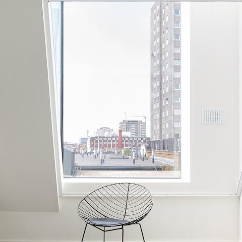 Find a sunny reading spot by the striking metre-long windows
