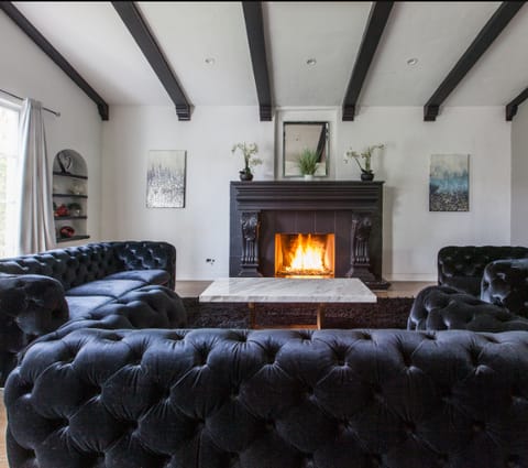 Curl up on the Chesterfields in front of the fire