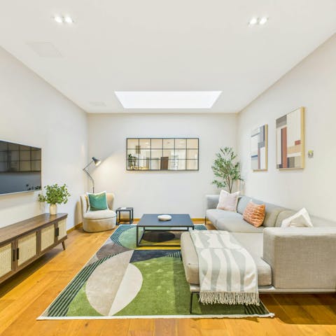 Relax in style in the light-filled, open-plan living area