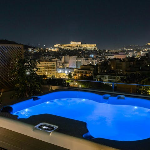 Admire the Acropolis by night from the Jacuzzi