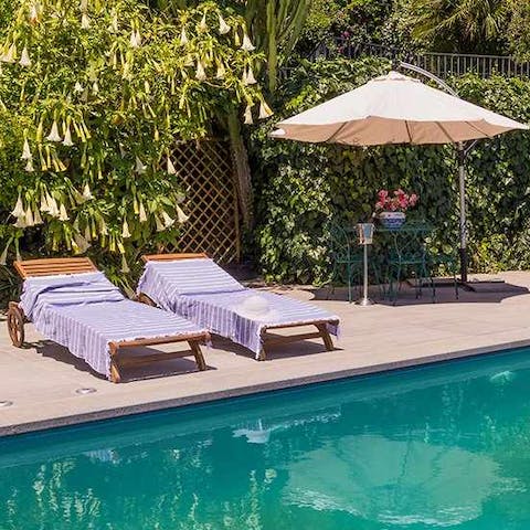 Relax and unwind by your the glistening waters of the infinity pool