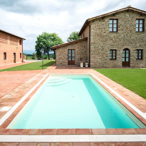 Go for a swim in one of the communal swimming pools overlooking rural Tuscany