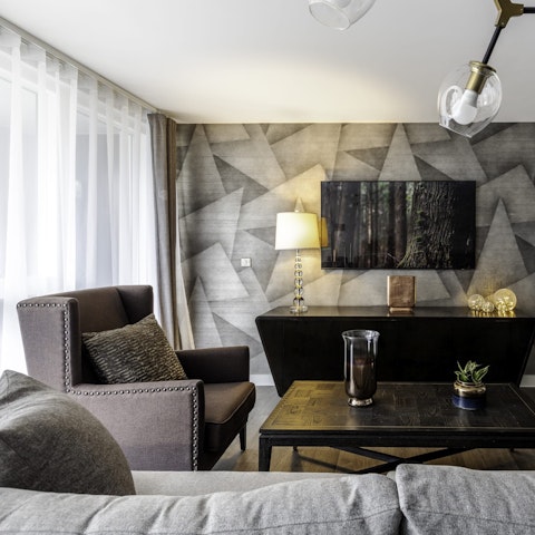 Lounge on the comfortable sofa and put something you love on TV