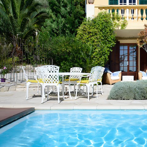Dine on baguettes and fine cheeses out by the pool