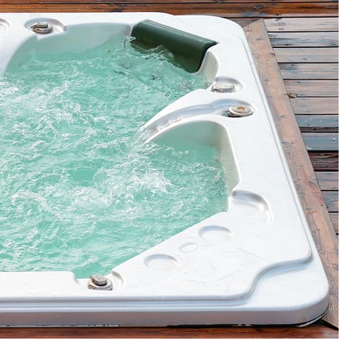Hop into the private hot tub and unwind after an action-packed day