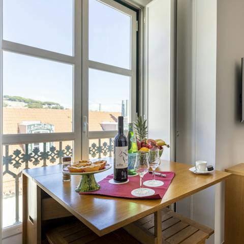 Start mornings off with coffee and a pasteis de nata while feasting on Chiado views