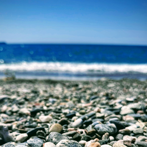 Take a dip at Spiaggia di Cala Rossa, ten-minute walk away