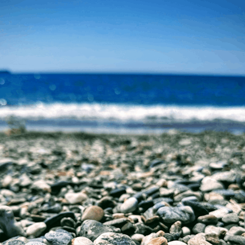 Take a dip at Spiaggia di Cala Rossa, ten-minute walk away