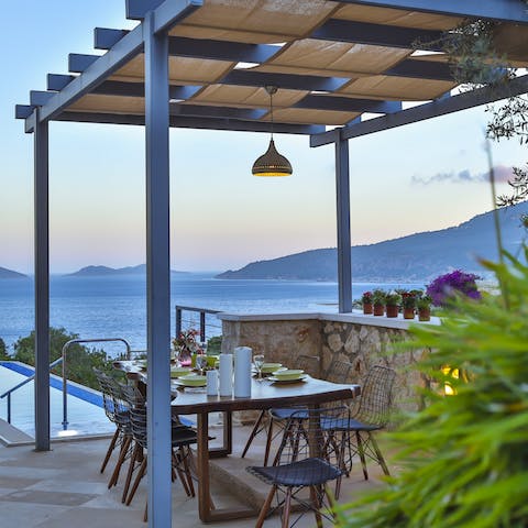 Share a family feast in the soft sunset light